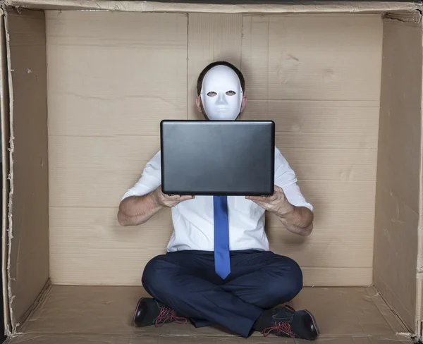 Hacker holds a computer — Stock Photo, Image