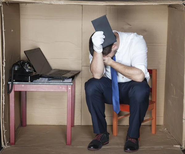 Businessman crying and holding bribe — Stock Photo, Image