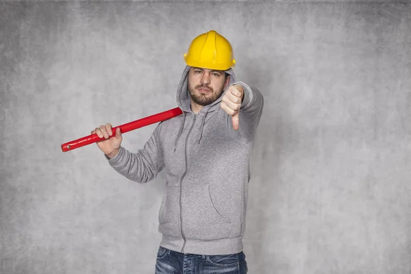 Thumbs down from manual worker — Stock Photo, Image