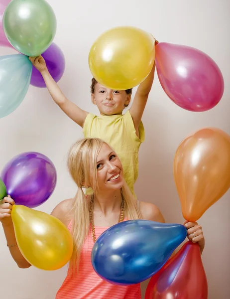 pretty real family with color balloons