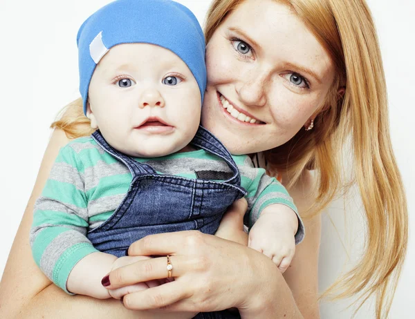 young beauty mother with cute baby, red head happy modern family isolated on white background close up, lifestyle people concept