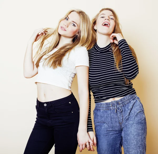 lifestyle and people concept: Fashion portrait of three stylish sexy girls best friends, over white background. Happy time for fun.