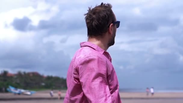 Young man on beach — Stock Video