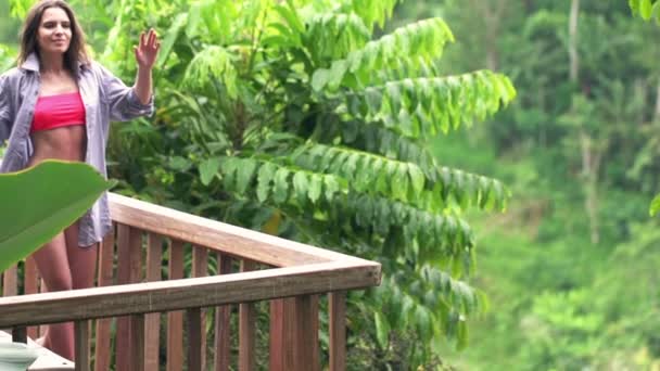 Sexy woman stretching her arms on terrace — Stock Video