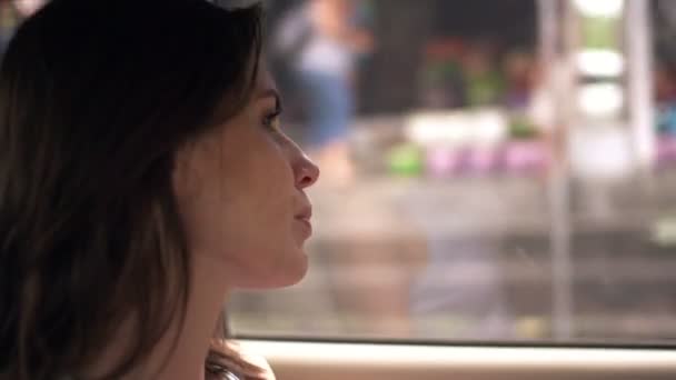 Young, pensive woman in car — Stock Video