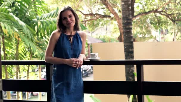 Woman standing on terrace — Stock Video