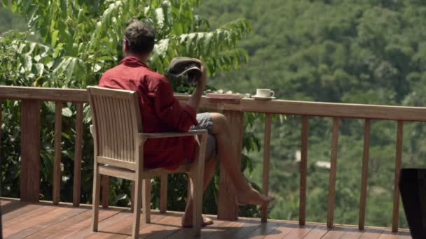 Man sitting on terrace — Stock Video