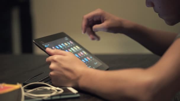 Teenager watching photos on tablet computer — Stock Video