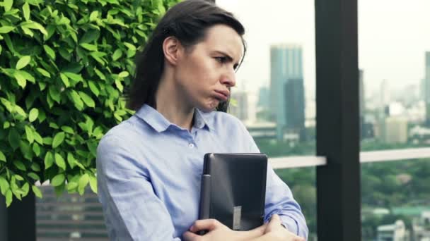 Sad, unhappy woman standing on terrace — Stock Video