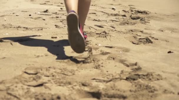 Woman running on the beach — Stock Video