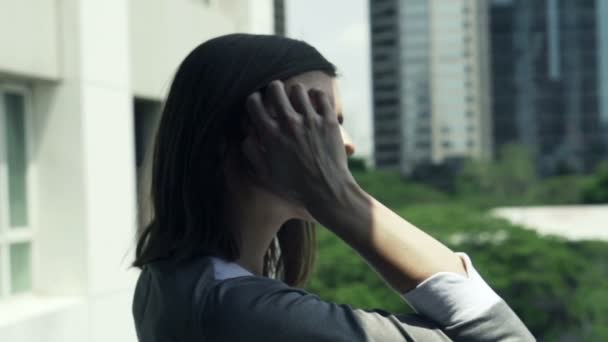 Pensive woman looking at city — Stock Video