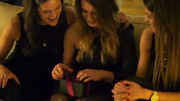 Woman gets gift from her girlfriends on hen party, slow motion — Stock Video