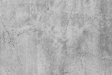 Eski beton zemin boş gri beton duvar arka planı. Çatlaklı çimento ve zaman ve hava koşullarından kaynaklanan doğal yıkım. Renksiz, tek renkli, siyah beyaz fotoğraf.