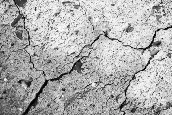 Concrete with Crack background. Old broken Cement Floor Wall. Chapped stone asphalt surface texture