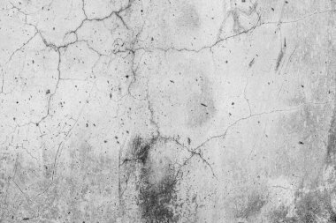 Çatlak arka planı olan bir beton. Eski kırık beton zemin duvarı. Çatlak taş asfalt yüzey dokusu. Kopyalama alanı için gri renk..