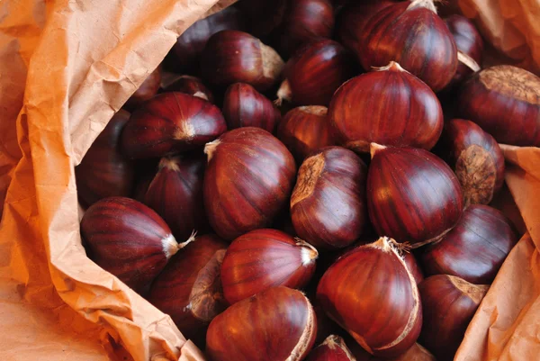 Roasted chestnuts on paper — Stock Photo, Image