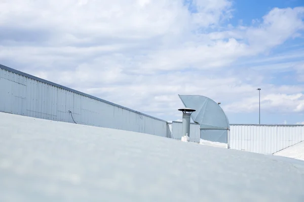 Four ventilation pipes over blue sky closeup — Stock Photo, Image