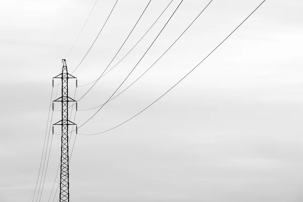 High voltage post at sunset — Stock Photo, Image