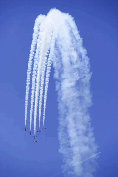 2011 in Granada, GRANADA, spain, SPAIN - JUNE 19: Aerobatic Spanish patrol (Eagle Patrol) perform at an airshow (Open day of the airbase Armilla) on June 19 — Stock Photo, Image