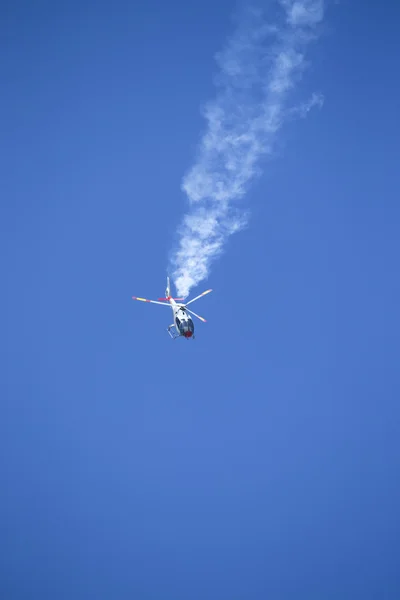 GRANADA,SPAIN - May 18: Aerobatic Spanish helicopter patrol (ASPA Patrol) perform at airshow (10 Aanniversary of Aspa Patrol in Granada) on May 18, 2014 in Granada ,Spain — Stock Photo, Image