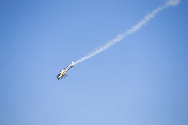 GRANADA,SPAIN - May 18: Aerobatic Spanish helicopter patrol (ASPA Patrol) perform at airshow (10 Aanniversary of Aspa Patrol in Granada) on May 18, 2014 in Granada ,Spain — Stock Photo, Image