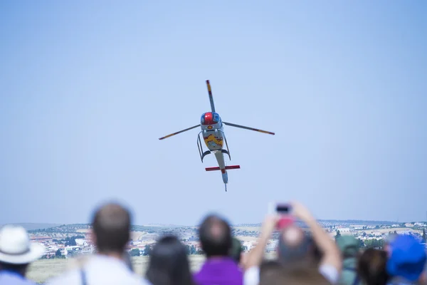 GRANADA,SPAIN - May 18: Aerobatic Spanish helicopter patrol (ASPA Patrol) perform at airshow (10 Aanniversary of Aspa Patrol in Granada) on May 18, 2014 in Granada ,Spain — Stock Photo, Image