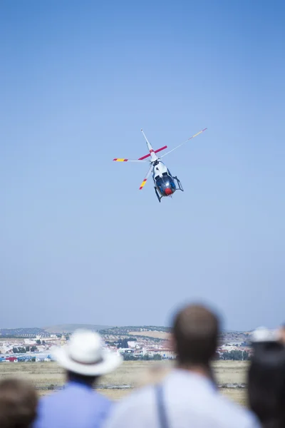 GRANADA,SPAIN - May 18: Aerobatic Spanish helicopter patrol (ASPA Patrol) perform at airshow (10 Aanniversary of Aspa Patrol in Granada) on May 18, 2014 in Granada ,Spain — Stock Photo, Image