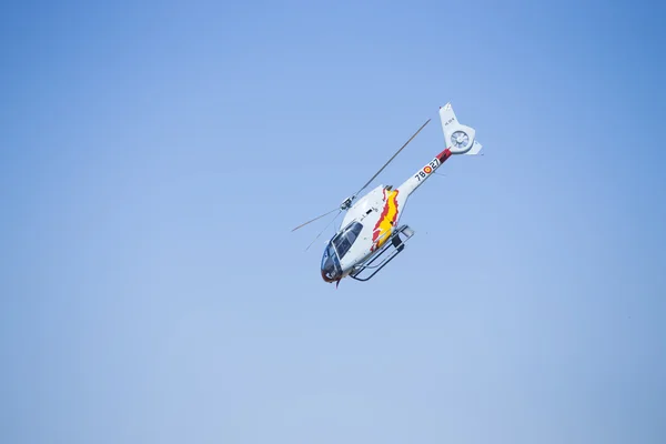 GRANADA,SPAIN - May 18: Aerobatic Spanish helicopter patrol (ASPA Patrol) perform at airshow (10 Aanniversary of Aspa Patrol in Granada) on May 18, 2014 in Granada ,Spain — Stock Photo, Image