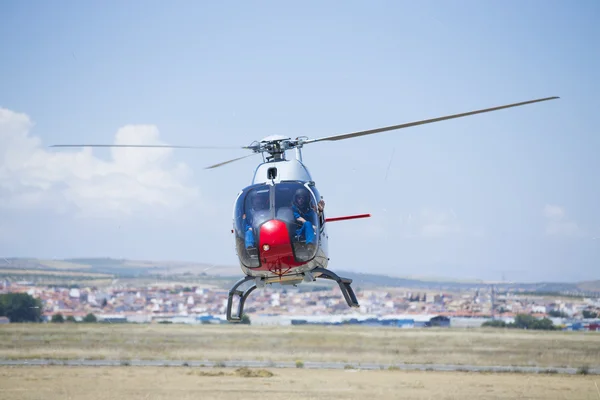 GRANADA,SPAIN - May 18: Aerobatic Spanish helicopter patrol (ASPA Patrol) perform at airshow (10 Aanniversary of Aspa Patrol in Granada) on May 18, 2014 in Granada ,Spain — Stock Photo, Image