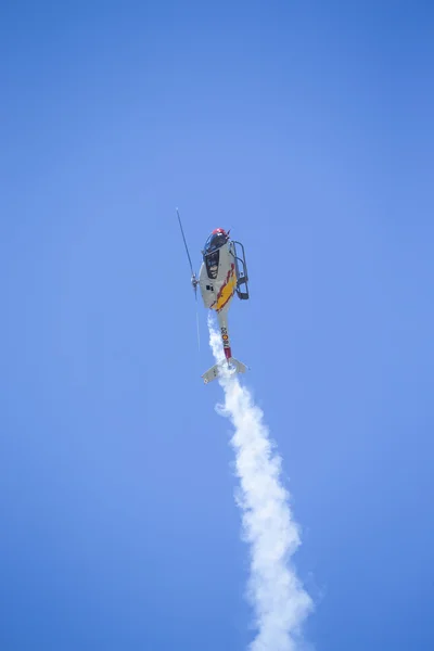 GRANADA,SPAIN - May 18: Aerobatic Spanish helicopter patrol (ASPA Patrol) perform at airshow (10 Aanniversary of Aspa Patrol in Granada) on May 18, 2014 in Granada ,Spain — Stock Photo, Image