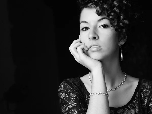 Beautyful young woman portrait. Jewerly and diamonds.