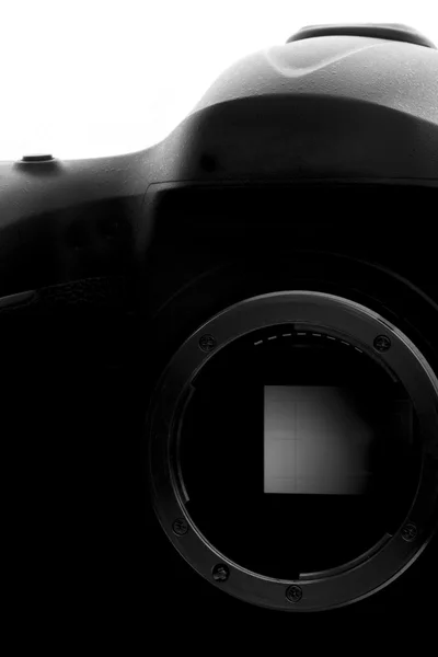 Önkéntelen fényképezőgép elszigetelt fehér. Sziluettjét profi Dslr. — Stock Fotó