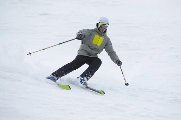 Skier in mountains, prepared piste and sunny day — Stock Photo, Image