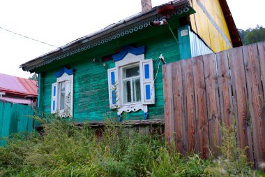 Typical house of Siberia near the Baikal lake in Russia clipart