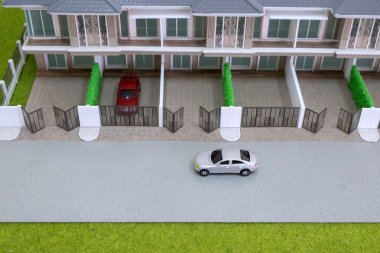 yolun önünde ev modeli üzerinde oyuncak araba