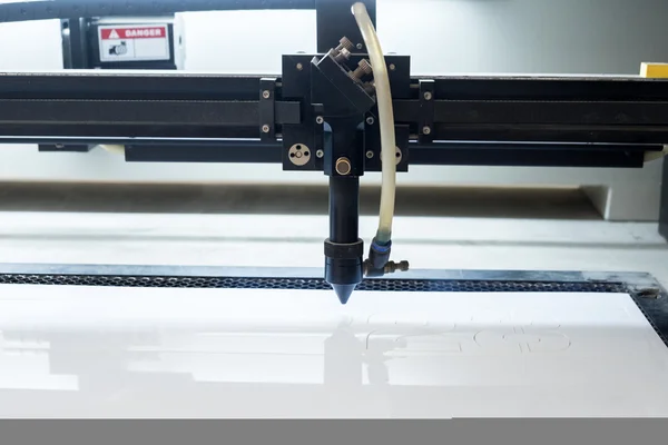 Cutting machine carving patterns on the plastic plate — Stock Photo, Image