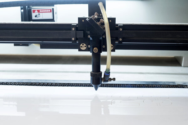 cutting machine carving patterns on the plastic plate