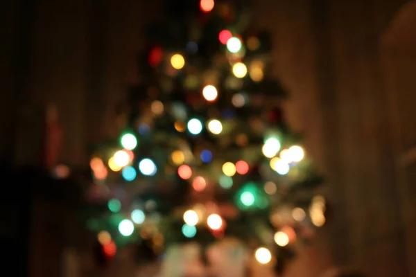 stock image Christmas tree out of focus. the colored circles