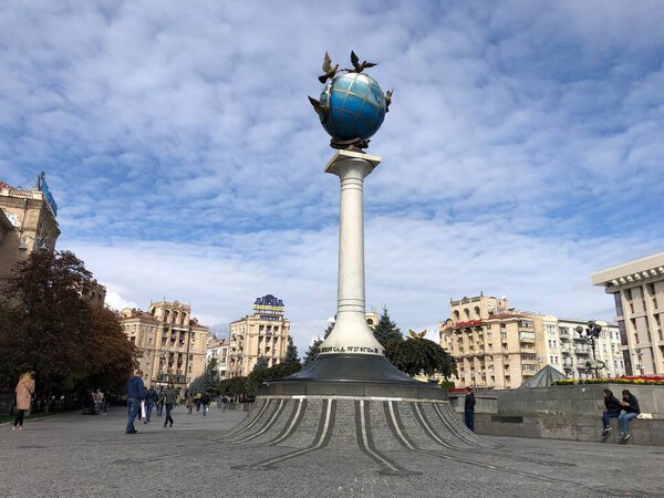 Kiev independence square monument planet and pigeons