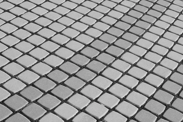 sidewalk tiles close-up. Black and white photo