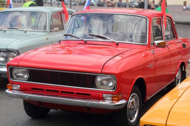 a car of the 70s on the street. Close up photo.