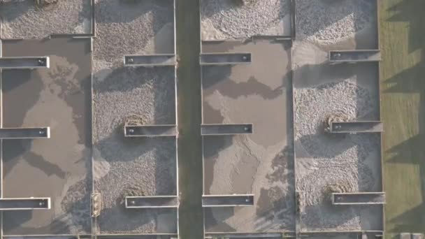 Drone flying directly above waste water plant — Stock Video