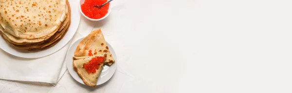 Thin pancakes with red caviar on white napkin. The concept of the Russian carnival Maslenitsa. space for text, banner — Stock Photo, Image