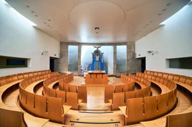 Visitors see the synagogue at Yad Vashem in Jerusalem. This place honors the memory of Holocaust victims through reflection and remembrance.