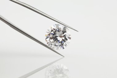 Big Loose Diamond Held in Tweezers clipart