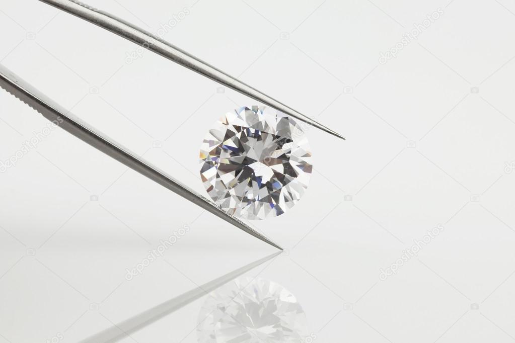 Big Loose Diamond Held in Tweezers