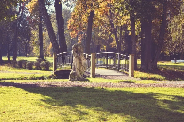 Old scultpure in the park — Stock Photo, Image