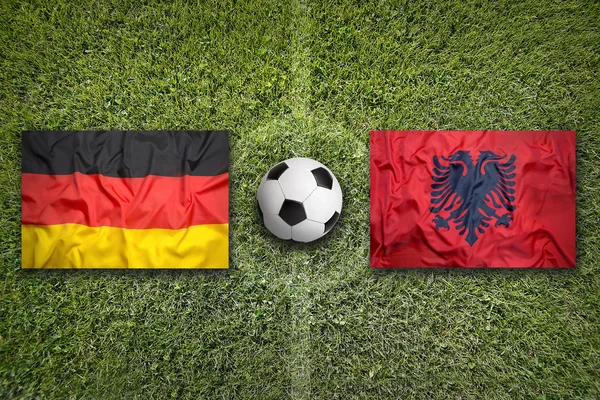 德国与阿尔巴尼亚国旗上足球场 — 图库照片