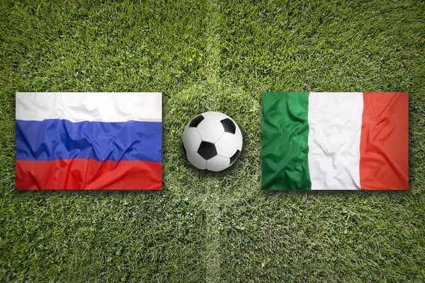 Russia vs. Italy flags on soccer field