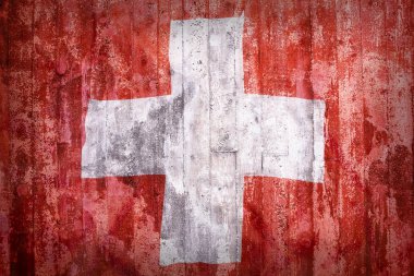Grunge tarzı bir tuğla duvara İsviçre bayrağı